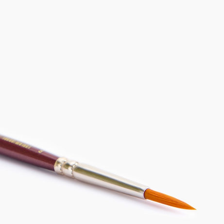 Close-up of Camel Synthetic Round Brush No. 6 pointed tip for fine lines and detail work