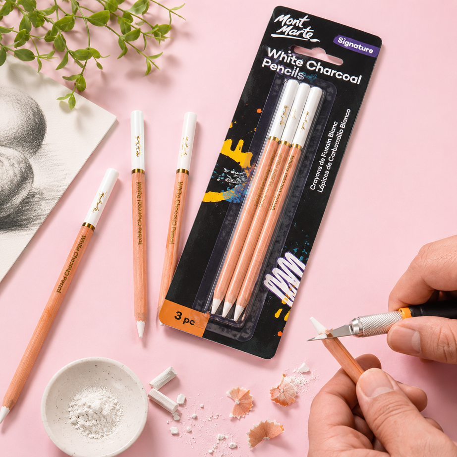 White charcoal drawing pencils from Mont Marte arranged in a 3 piece set