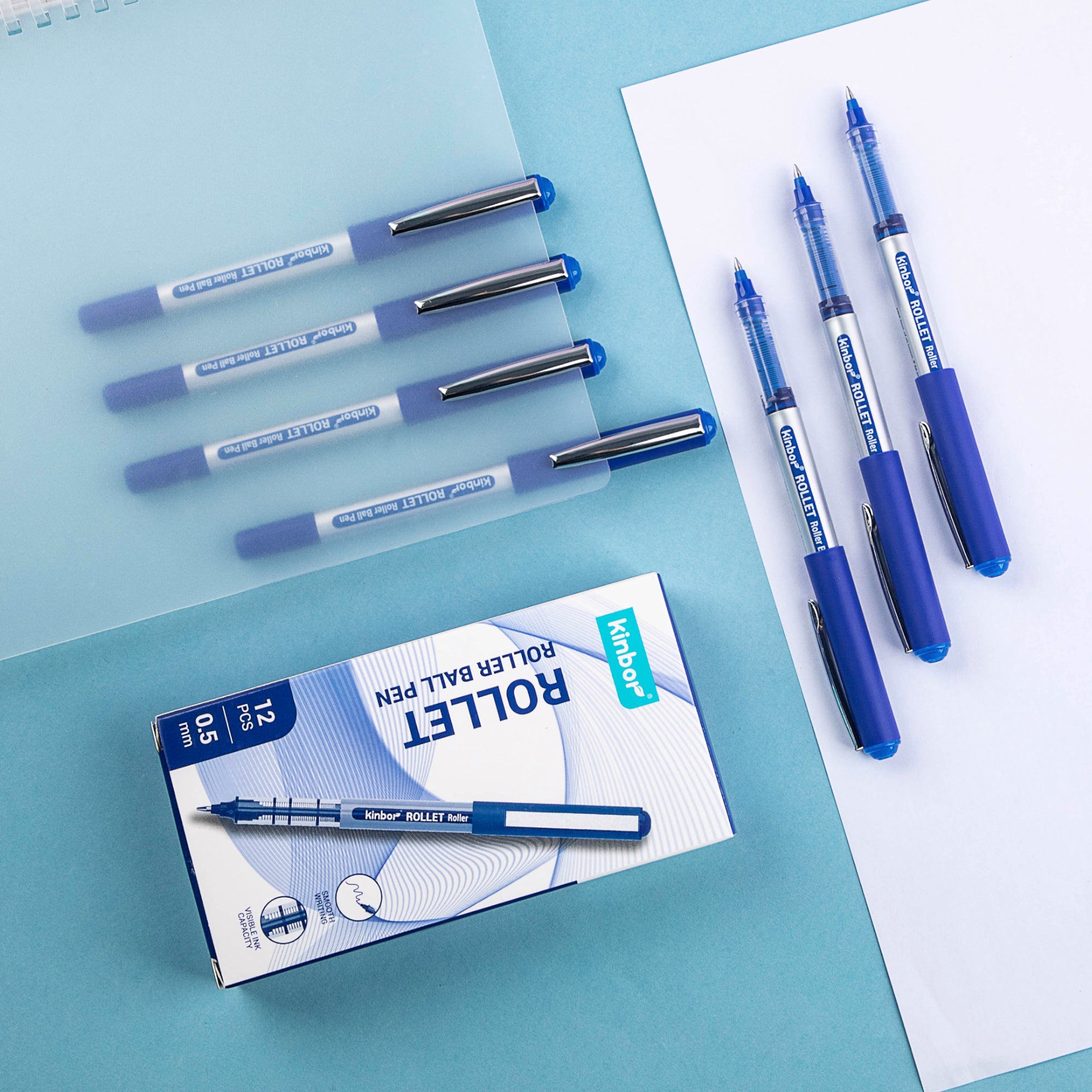 Klarirol roller ball pens with packaging on a blue background